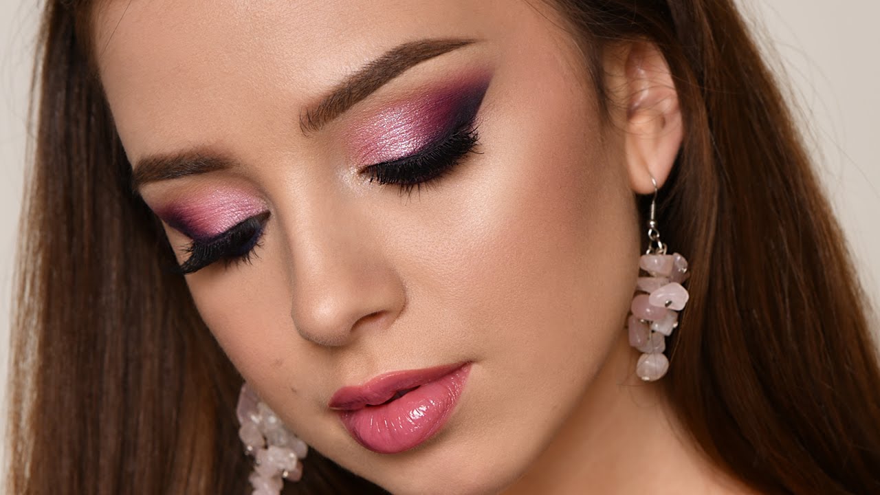 Professional bridal makeup showcasing rosy cheeks and defined eye makeup applied with precision brush on model face