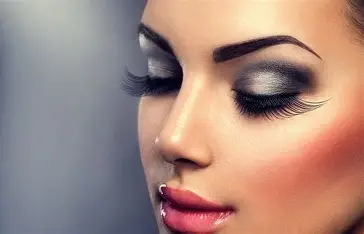 Bridal makeup application featuring blended eyeshadow and sculpted cheekbones creating an elegant polished look